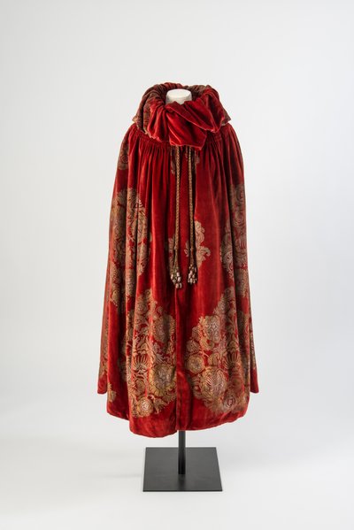 Dark Red Velvet Cloak with a Gold and Silver Stenciled Floral Design and Silk Tassels Trimmed with Painted Beads, c.1923 by Maria Monaci Gallenga